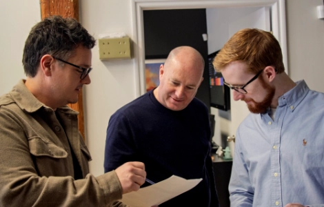 REM Employees Discussing Case Study